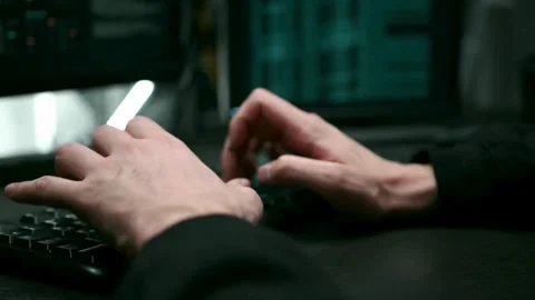 Close up of male hands typing programming on screen laptop Camera slides around Stock-Footage 334586586