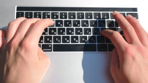 Close up of male hands typing some text on notebook keyboard. Woman working Stock Footage 126986779