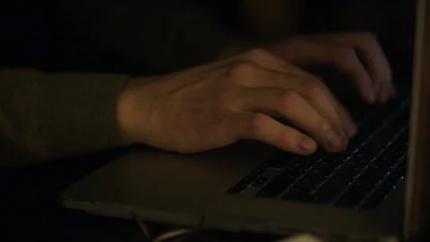 Close up of male hands typing text or programming code in computer in natural Stock Footage 89714735