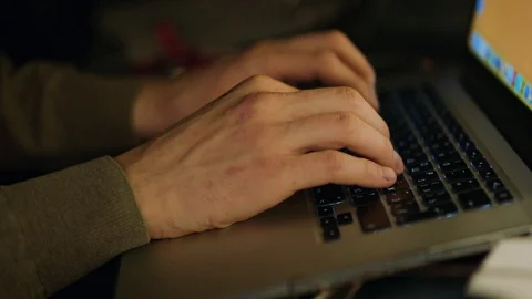 Close up of male hands typing text or programming code in computer in natural Stock Footage 89714760