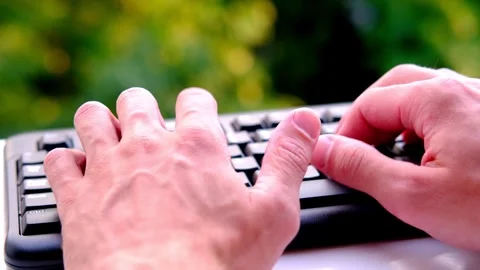 Close-up male hands typing text on black keyboard, computer technologies an.. Stock Footage 255595675