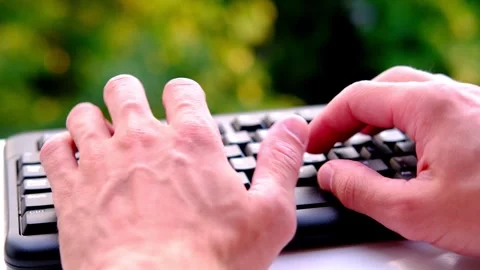 Close-up male hands typing text on black keyboard, office environment, comp.. Stock Footage 273069641