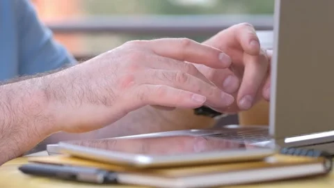 Close-up of male hands using on laptop. Side view. Concept of remote work, Stock Footage 242009635