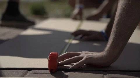 Close up male hands using measuring roulette Stock Footage 123712597