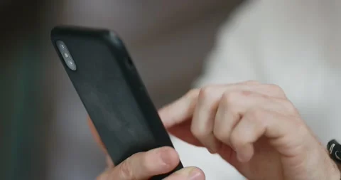 Close-up of male hands using mobile phone Stock Footage 197816857