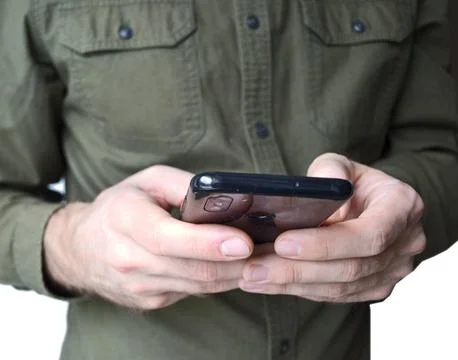 Close-up of male hands using a mobile smartphone. Phone in men's hands. Stock Photos