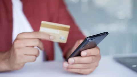 Close up of male hands using phone to make online transaction with credit card  Stock Footage 311622962