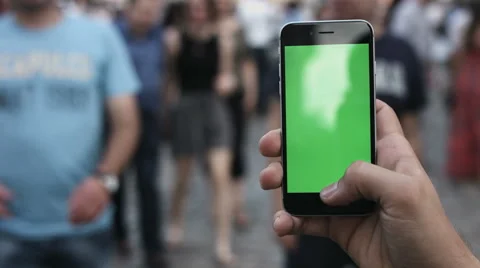 Close-up of male hands using smartphone outdoors in the city center. hroma Key Stock Footage 64547937