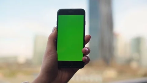 Close-up of male hands using smartphone outdoors in the city center. hroma Key Stock Footage 73839762