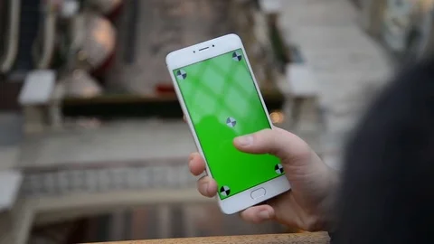 Close-up of male hands using smartphone outdoors in the city center. hroma Key Stock Footage 73910195