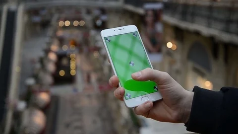 Close-up of male hands using smartphone outdoors in the city center. hroma Key Stock Footage 73910270