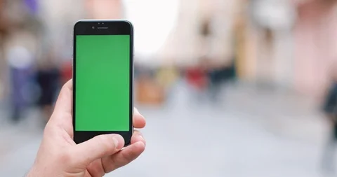 Close-up of male hands using smartphone outdoors in the city center. Close up Stock Footage 87382188