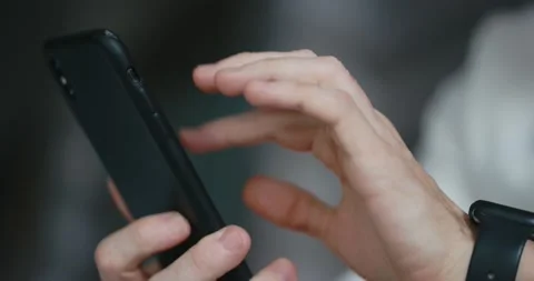 Close-up of male hands using smartphone Video stock 197561122