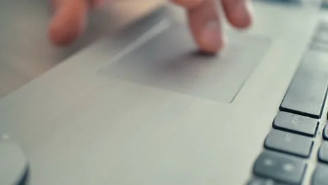 Close-up. Male hands work with the touchpad of a laptop, Input Video stock 218022367
