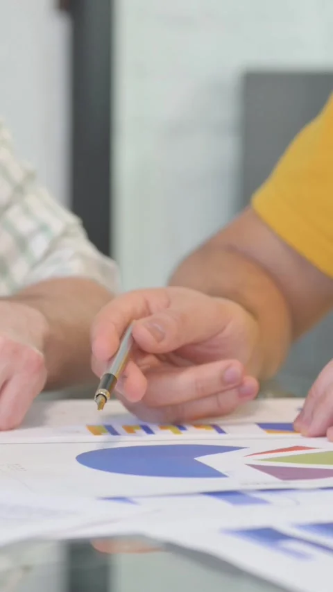 Close up of Male Hands Working on Documents, vertical video Video stock 325563641