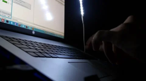 Close-up of Male Hands Working on Laptop Late at Night. Видео 44237551