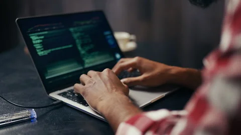 Close-up of male IT engineer upset with system error message on laptop screen Stock Footage 313281796
