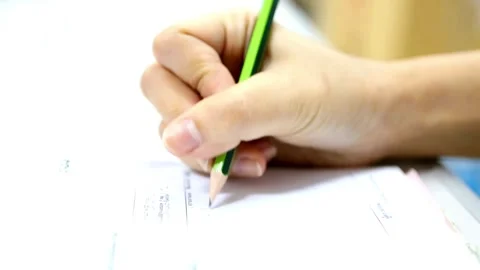 A close up of a male physician's hand writing out a prescription close up of Stock-Footage 336587859