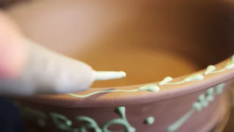 Close Up Of Male Potter Pattern Onto Bread Bowl In Ceramics Studio Stock Footage 134063992