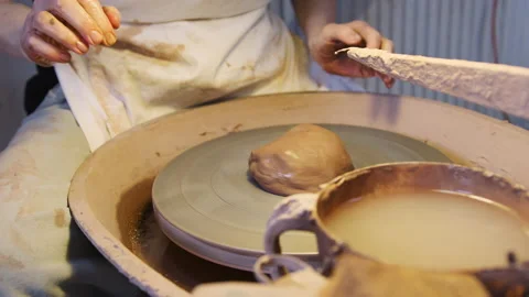 Close Up Of Male Potter Throwing Clay For Pot Onto Pottery Wheel In Ceramics Stock Footage 132274457