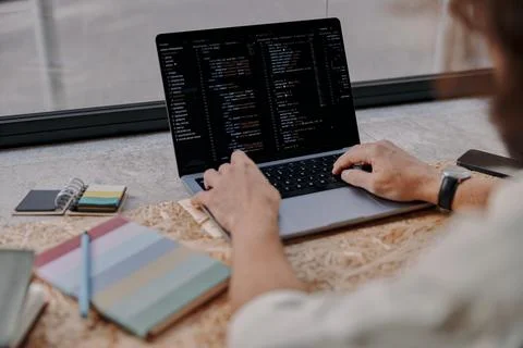 Close up of male programer hands write code on laptop sitting in cafe near 스톡 사진