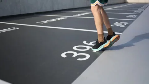 Close up of male runner legs during active outdoor cardio workout Stock Footage 346364471