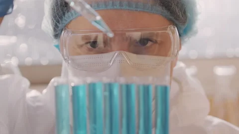 Close up of male scientist man microbiologist virologist researcher filling test Video stock 145572959