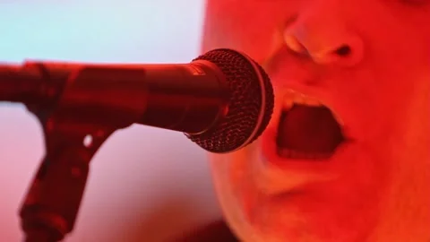 Close Up of male singer Stock Footage 149599941