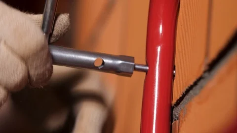 Close up of a male worker hands using socket wrench to attach metal tube to the Stock Footage 123769277