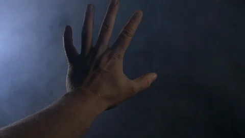 Close Up A Males Hand Floating Around In A Smokey Dark Room Stock Footage 123707763