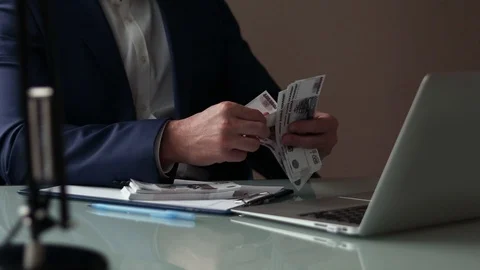 Close-up of the males hands counting a large amount of cash money. Stock Footage 97045980