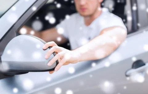 Close up of man adjusting car sideview mirror Stock Photos