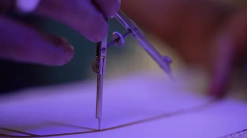 Close up of a man adjusting a compass and measuring points on a technical Video stock 284721828