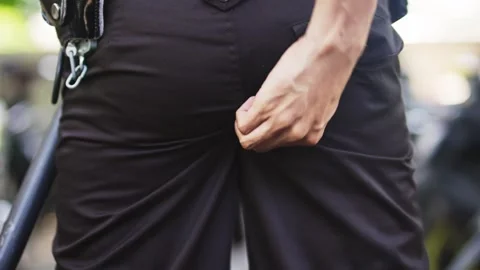 Close Up of Man Adjusting His Pants from Behind Stock Footage 344236015