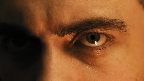 Close-up of a man angrily glaring past the camera. Stock Footage 251257347