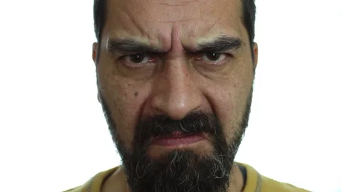 Close up, a man with angry face on a white background Stock Footage 142153216