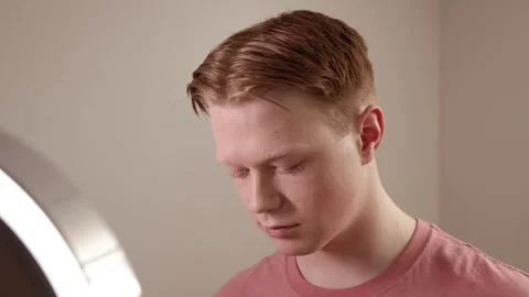 A Close-Up Of A Man Applying Powder Makeup Mirror Beauty Routine Stock Footage 309367005