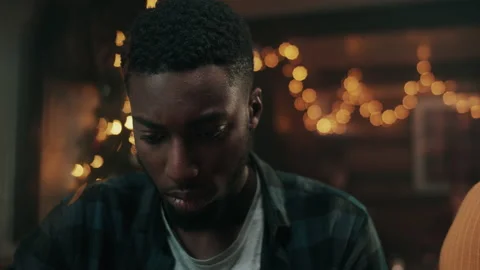 Close up of a man at the bar looking down on his phone and smiling Stock Footage 132015475