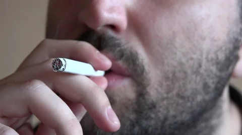 Close up man beard lighting a cigarette, smoking, addiction, lung illness, habit Stock Footage 61543948