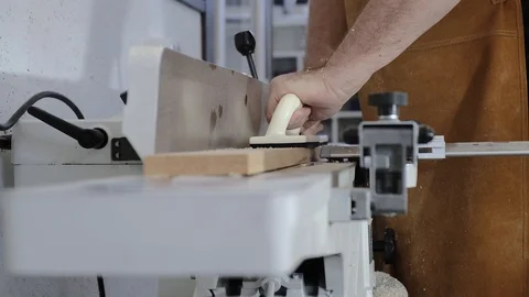 Close-up. A man with a beard works in his workshop. Profession carpenter. A man Stock Footage 113994663