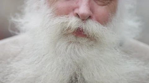 Close up of a man with a beard's mouth talking to camera Stock Footage 92450608