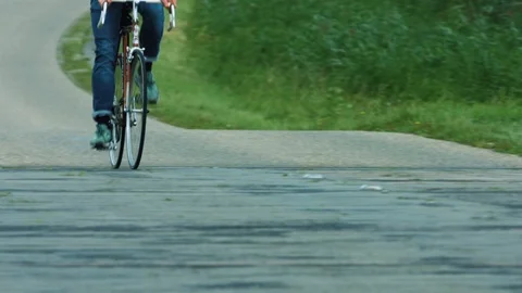 Close-up Of Man On Bicycle Passing By Over A Bridge Stock Footage 127179879