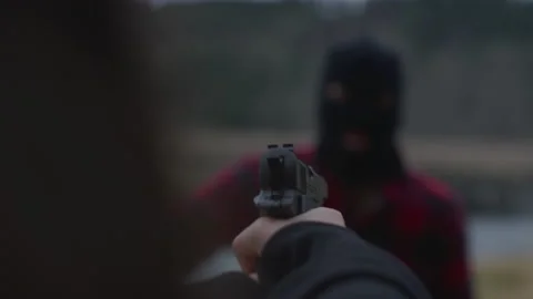Close-up of Man in Black Ski Mask Being Shot Stock Footage 208754819