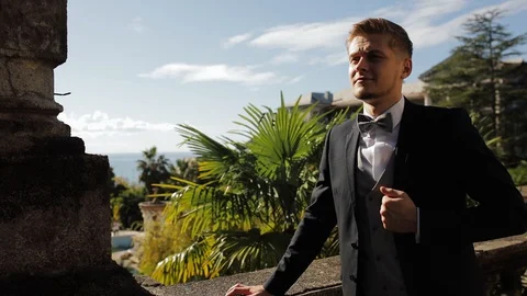 Close up man in blue suit staying near the window. Back view. Stock Footage 129781684