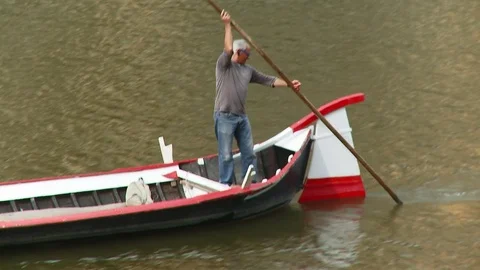 Close up of man in boat on the river Arno, Florence, Italy Stock Footage 74797671