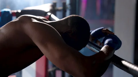 Close-up man boxer standing with arm scrossed on edge boxing, bowed head Stock Footage 241670958