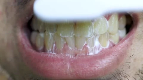 Close up man brushing teeth in the morning Stock Footage 163906327