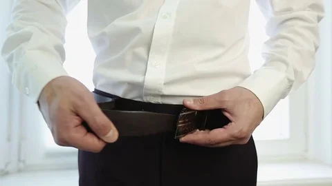 Close up. Man buttoned the belt for trousers. Stock Footage 72165094