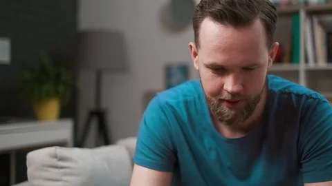 Close-up man buying online,using smartphone and a credit card at home, shopping Stock Footage 108789544