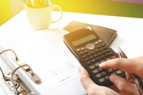 Close up of man with calculator counting making notes in the crisis at home.. Stock Photos